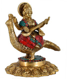 White Whale Maa Saraswati Sitting On Peacock Brass Statue With Multicolor Stone Work Religious Goddess Sculpture Idol Home Décor
